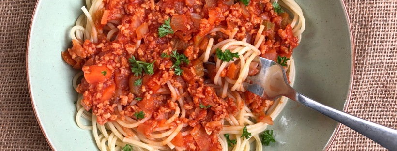 vegan bolognese and spaghetti noodles. the bolognese is made with organic soya mince
